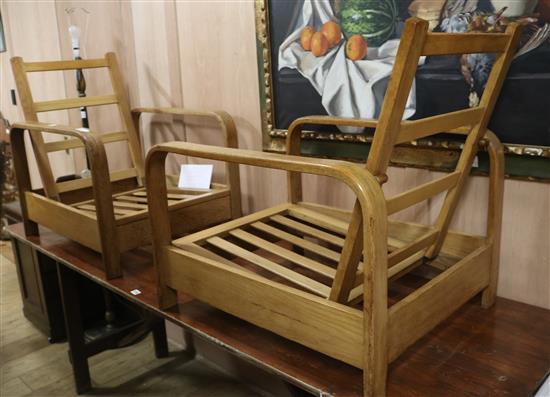 A pair of 1940s natural finish reclining chairs